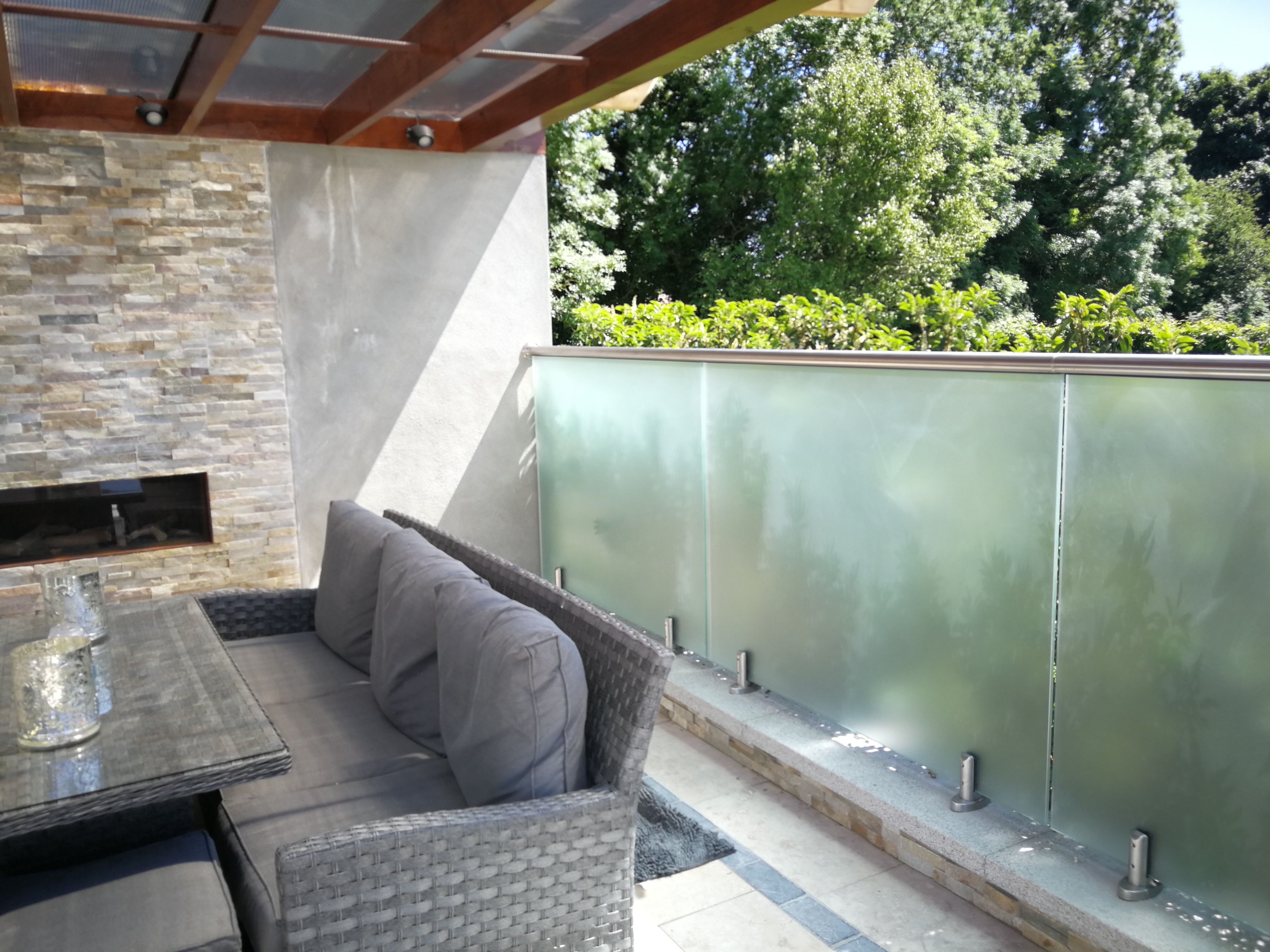 Allspec privacy glazing beside a finished garden patio in Garristown