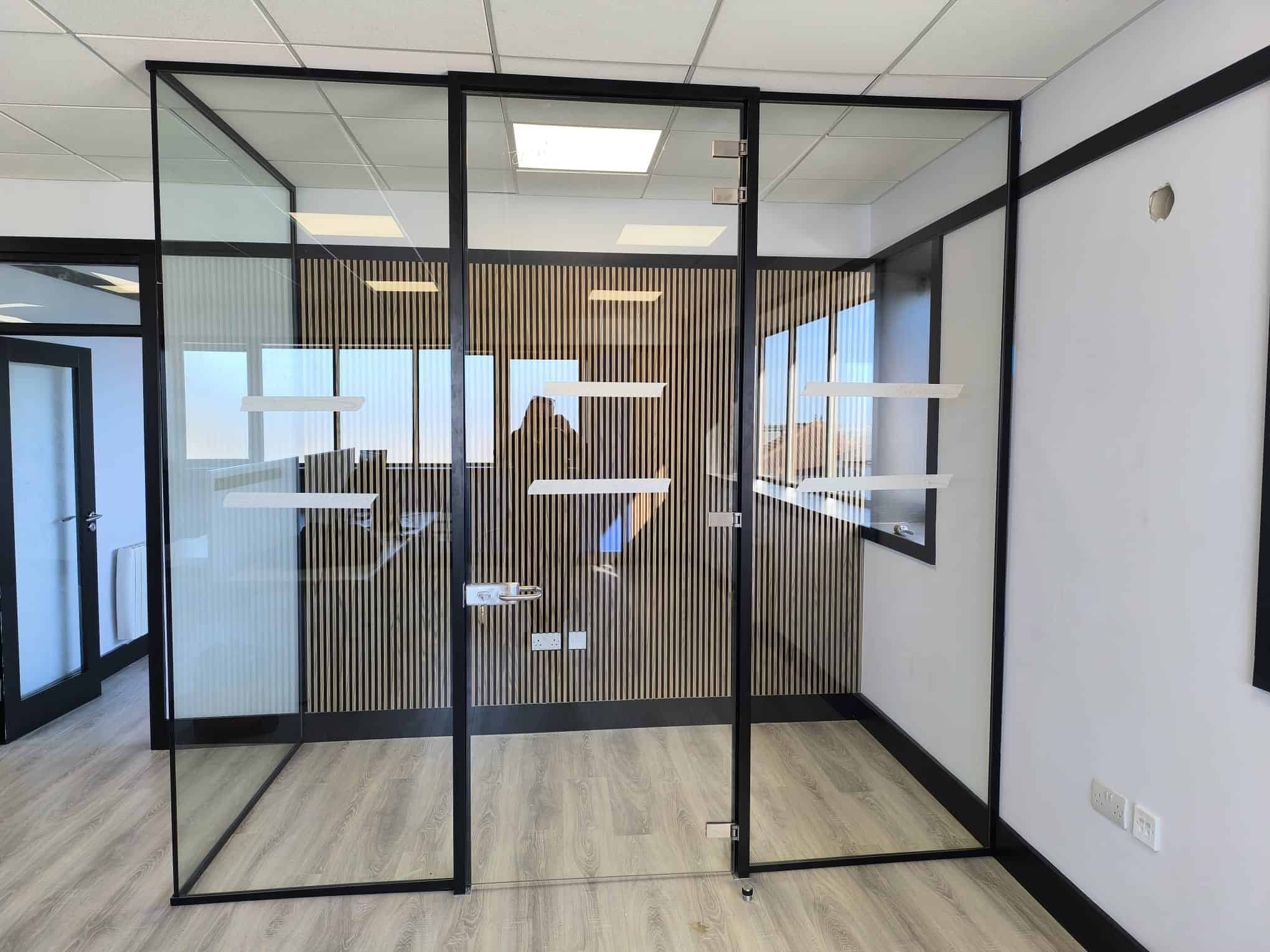 Allspec full-height black-framed glass office partition in Ranelagh